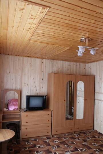 Фото номера Стандартный семейный номер Гостевой дом Gutsulochka Apartment г. Яремче 4